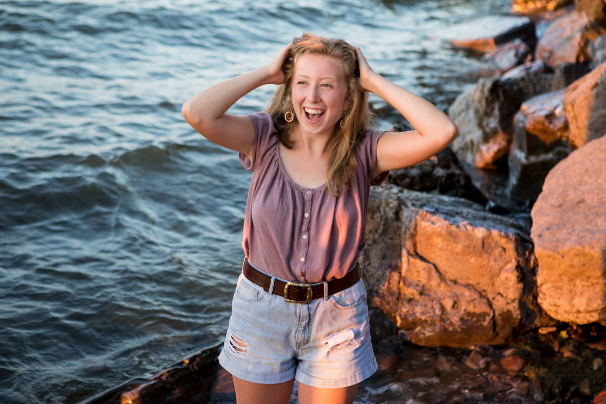 High School Senior Girl Laughing by Lake Ontario