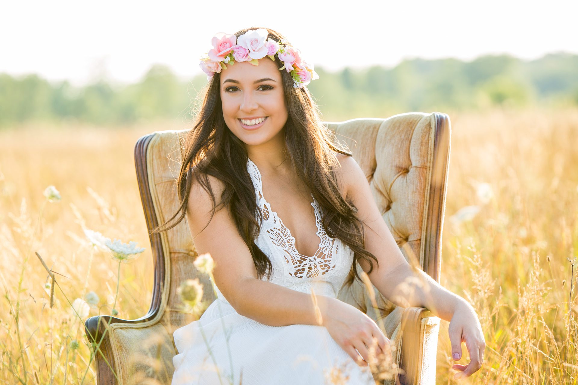 Boho Senior Girl with flower crown in a field